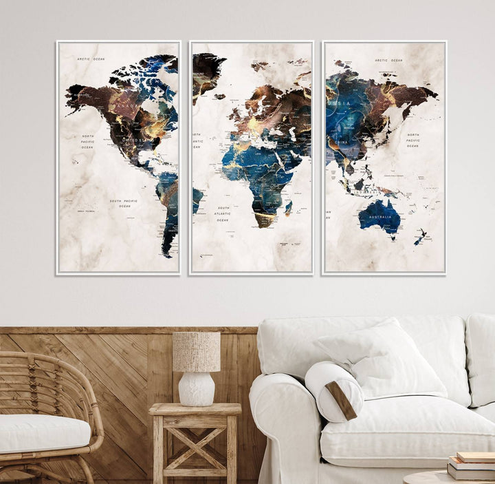 Abstract earth-toned 3-panel world map wall art featuring blues and browns, ready to hang; it showcases continents on modern canvas.