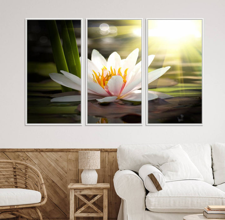 The Lotus Flower Wall Art Canvas Print showcases a white water lily with a yellow center floating gracefully in sunlight.