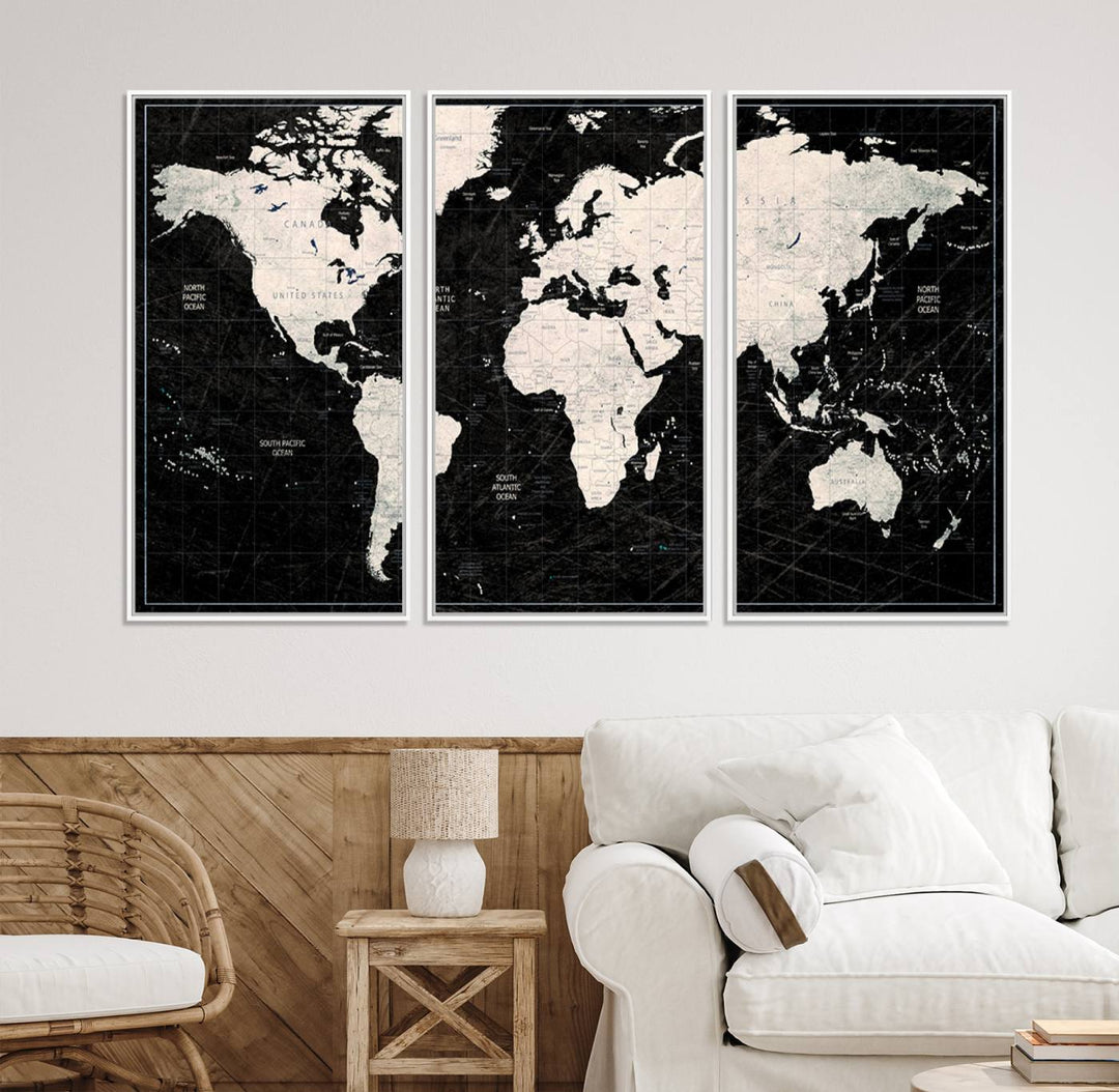 A bold global style framed black and white world map canvas print, presented in three panels, perfect for modern home or office decor.