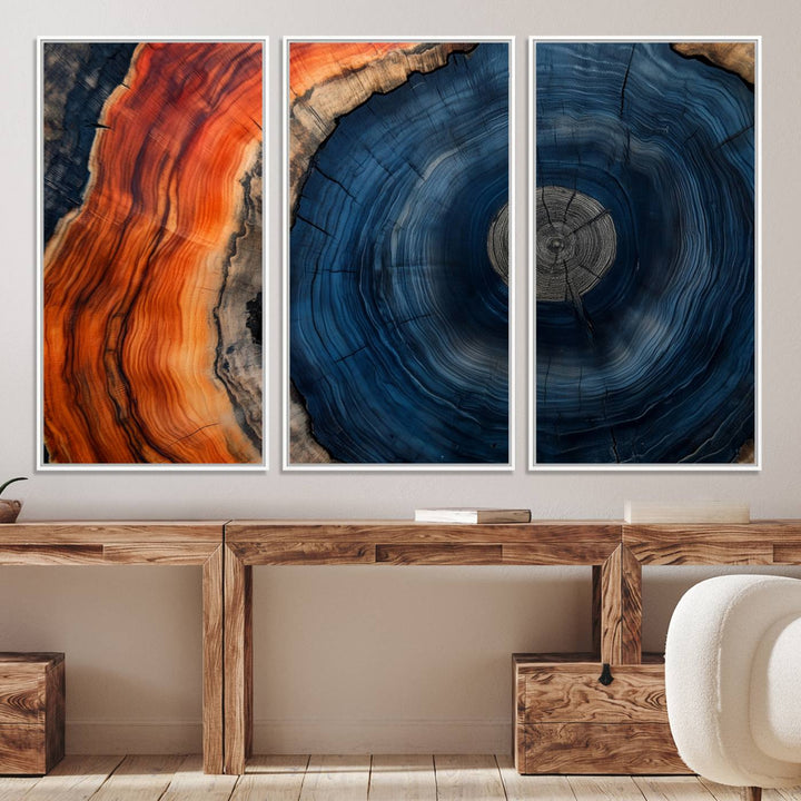 Abstract Tree Ring Wall Art Print on canvas featuring vibrant blue, orange, and brown rings with a natural rustic wood texture. Free shipping available!.