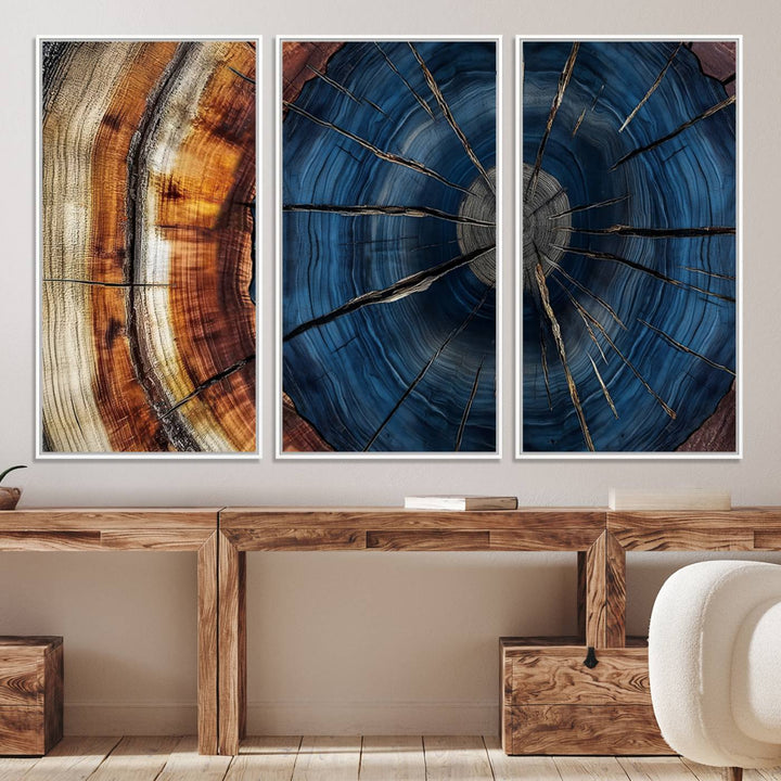 The Abstract Tree Rings Canvas Print features blue, brown, and orange rings that highlight wood grain and natures beauty.