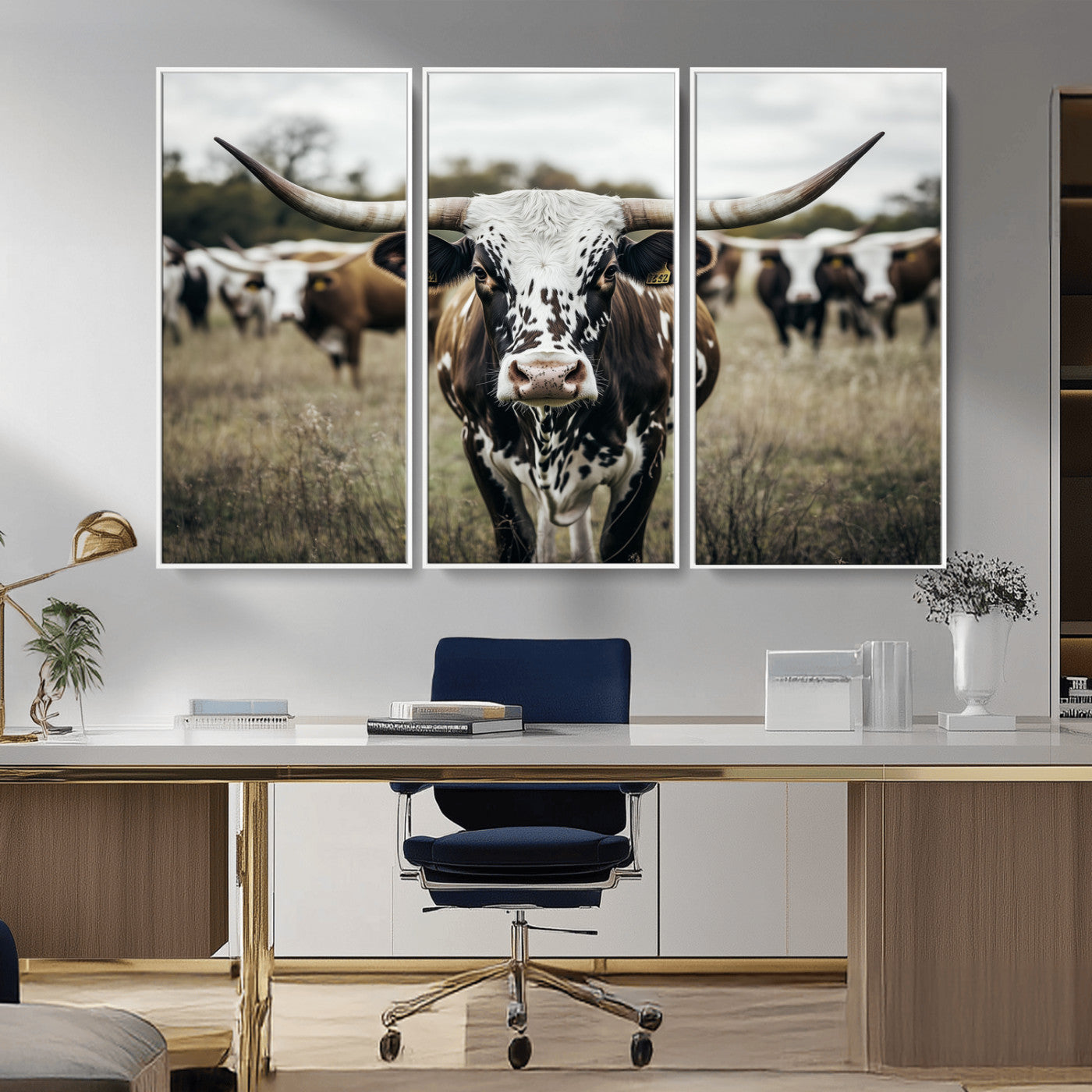 Canvas of a speckled Texas longhorn standing boldly in a field with a herd behind, perfect for rustic western or farmhouse wall decor.
