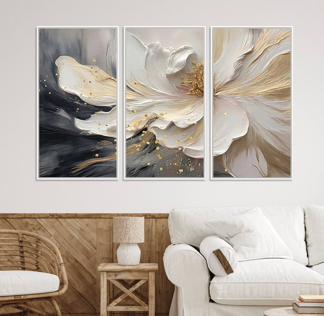 Elegant White and Gold Floral Triptych Canvas Art, a modern textured flower painting for home or office decor, features a blurred gray background.