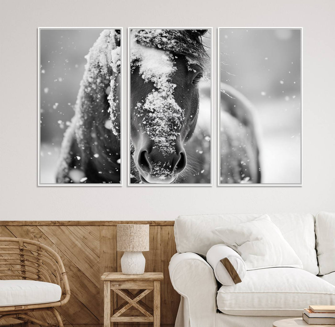 The Black and White Horse Winter Wall Art features a majestic horse with snow-covered hair set against a serene winter backdrop.