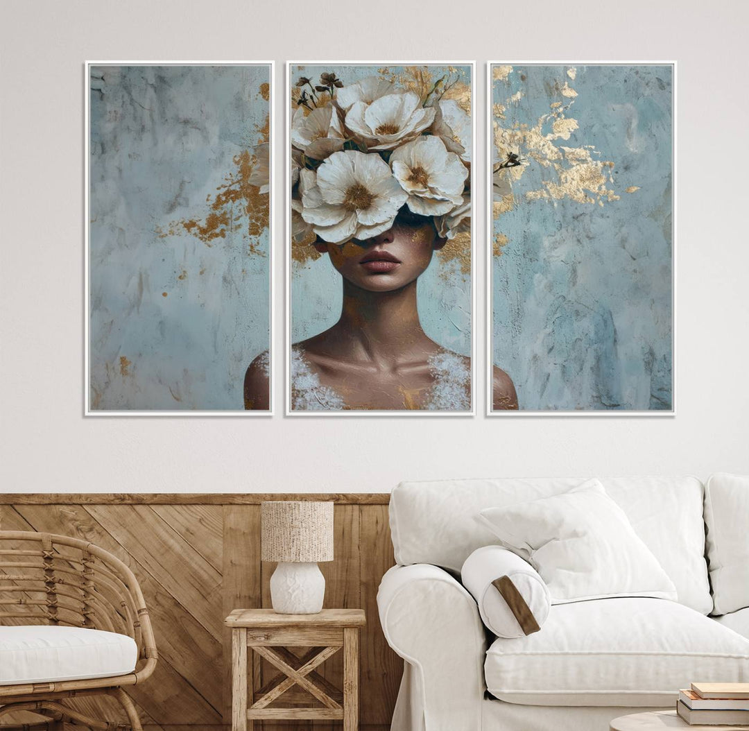 Golden Petal Wall Art: A womans face adorned with a gold floral design on a teal background, presented in a 3-panel modern glam canvas.