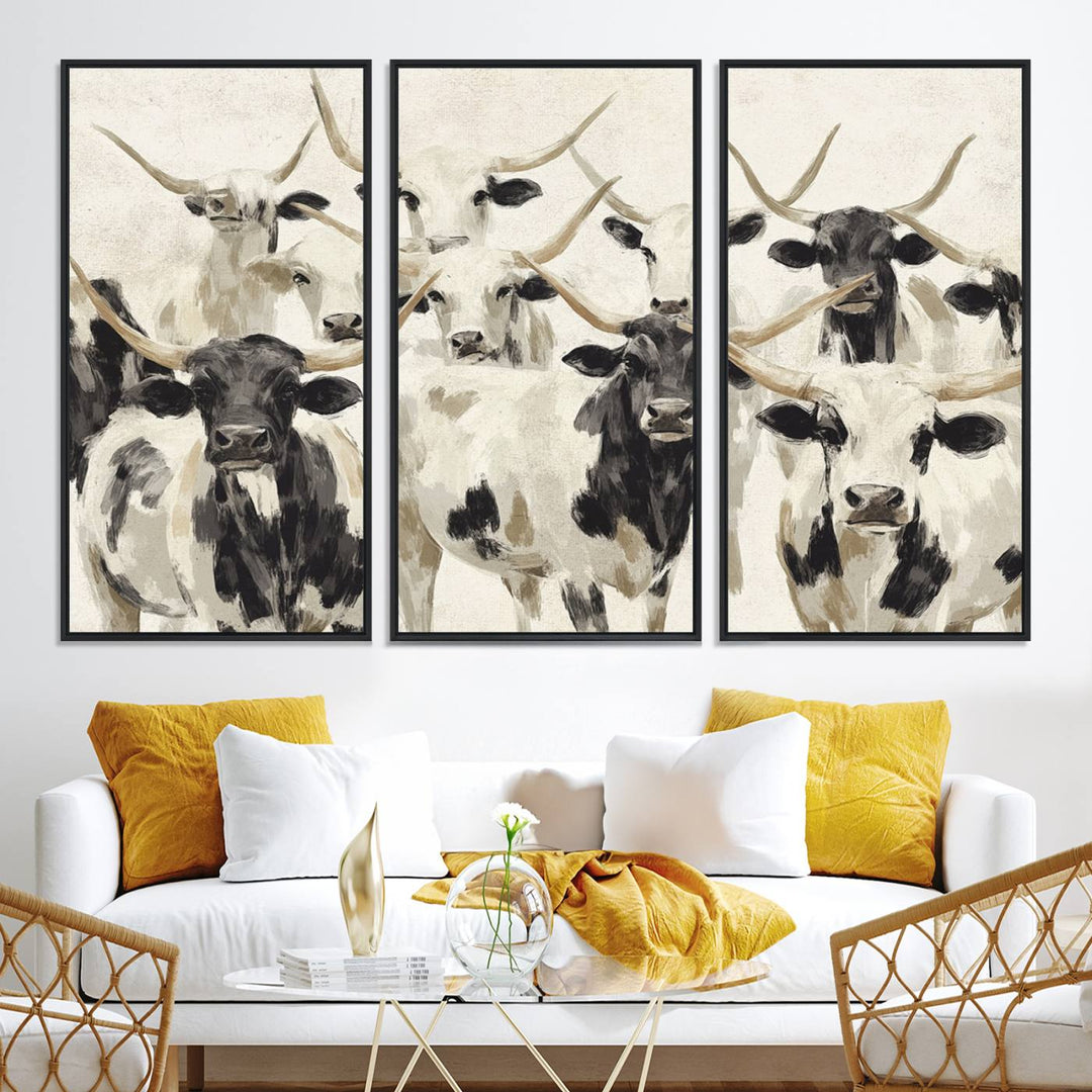 Canvas print titled Longhorn Texas Cow Drawing, depicting longhorn cattle with black and white markings, made in the USA, displayed on the wall.