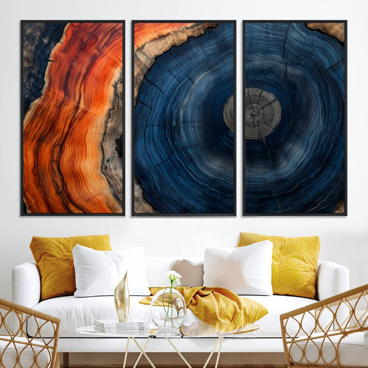 Abstract Tree Ring Wall Art Print on canvas featuring vibrant blue, orange, and brown rings with a natural rustic wood texture. Free shipping available!.