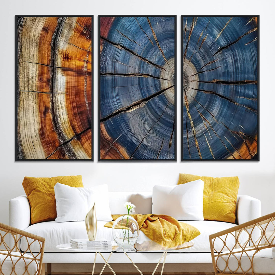 Close-up of blue, brown, and orange wood grain rings on the Abstract Tree Rings Canvas Wall Art Print.