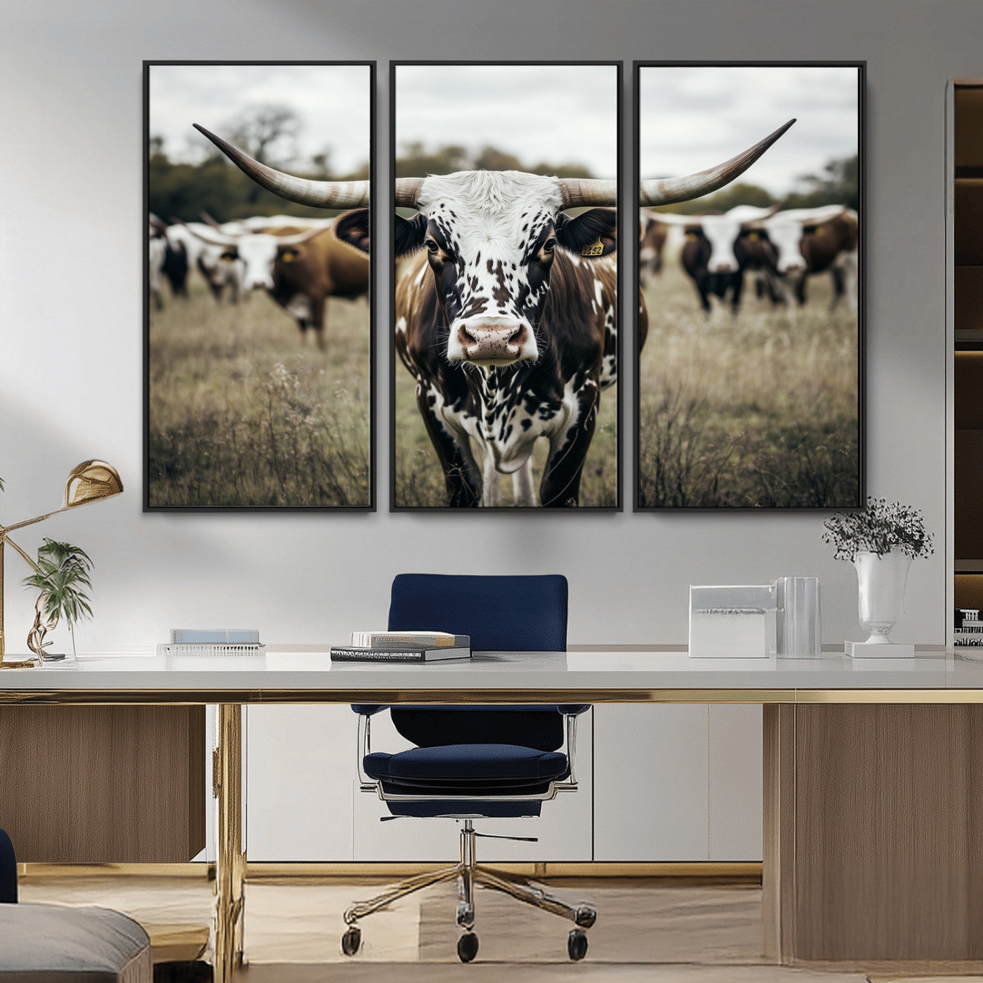 Canvas of a speckled Texas longhorn standing boldly in a field with a herd behind, perfect for rustic western or farmhouse wall decor.