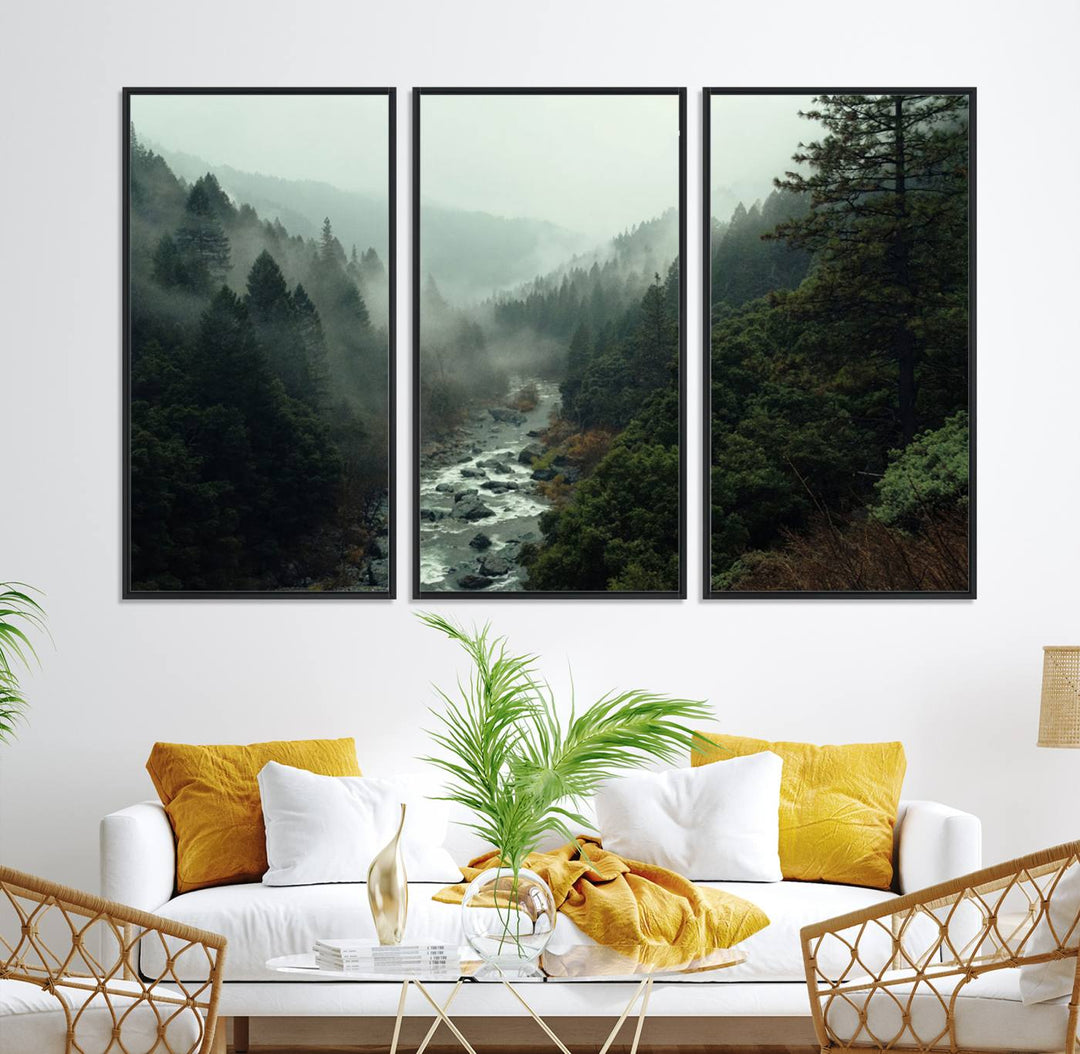 The Misty Forest Wall Art features a serene landscape with a misty river and evergreens, ideal for enhancing the ambiance of any living room or cabin.