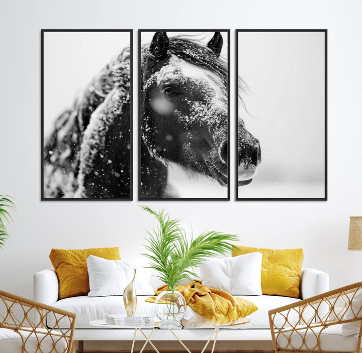 A large 3-panel rustic farmhouse wall art showcases a black and white winter horse canvas print against a snowy backdrop.