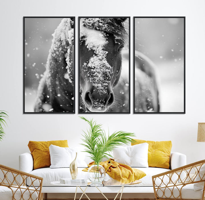 The Black and White Horse Winter Wall Art features a majestic horse with snow-covered hair set against a serene winter backdrop.