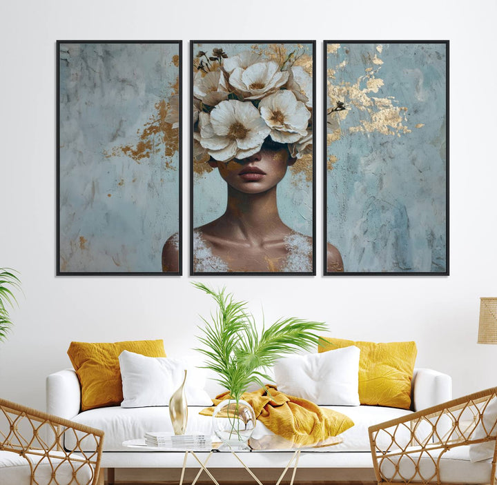 Golden Petal Wall Art: A womans face adorned with a gold floral design on a teal background, presented in a 3-panel modern glam canvas.