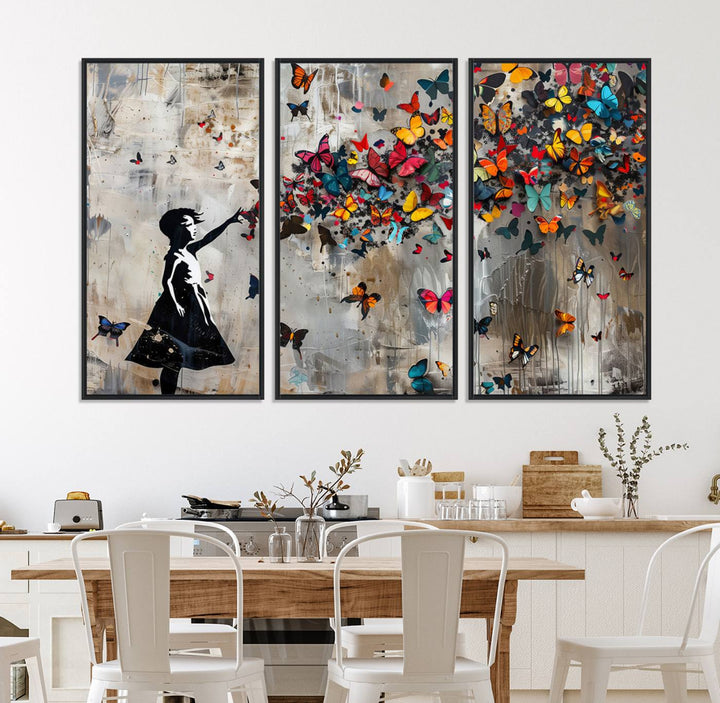 The Banksy Butterfly Girl 3-Piece Modern Graffiti Canvas Wall Art features a silhouette of a girl reaching for butterflies.