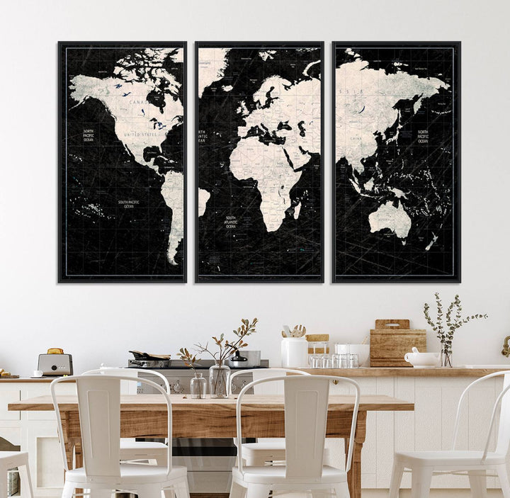 A bold global style framed black and white world map canvas print, presented in three panels, perfect for modern home or office decor.