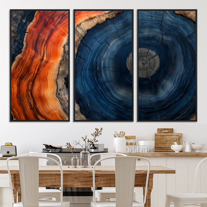 Abstract Tree Ring Wall Art Print on canvas featuring vibrant blue, orange, and brown rings with a natural rustic wood texture. Free shipping available!.