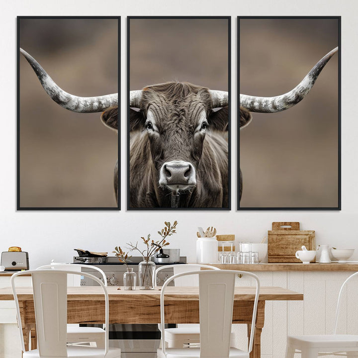 A close-up of a longhorn bull facing forward is featured in the Framed Texas Test-1, set against a blurred brown background.