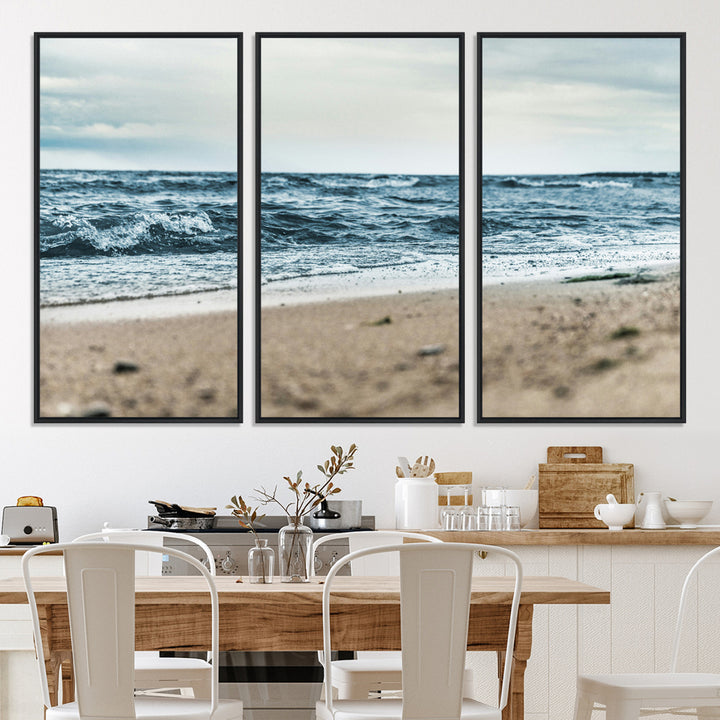 A moody ocean scene with gentle waves washing onto a sandy beach under a cloudy sky, creating a peaceful and coastal atmosphere.