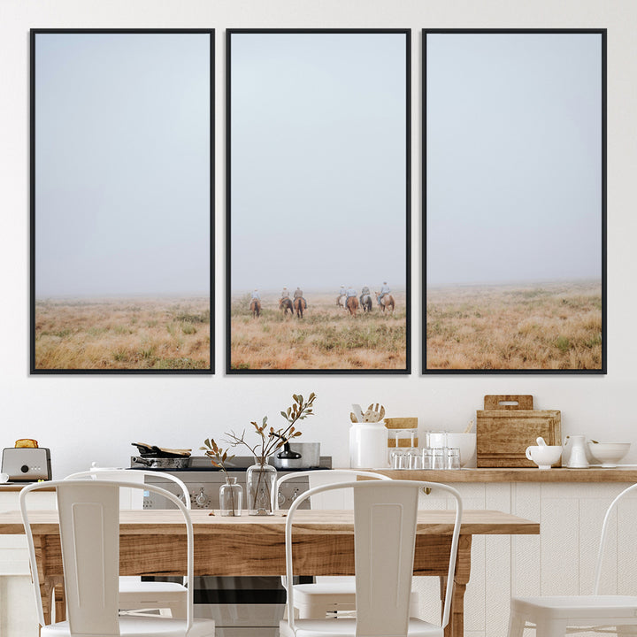 A group of horseback riders moving through a fog-shrouded field, evoking a calm Western scene with golden grasses and soft horizons.