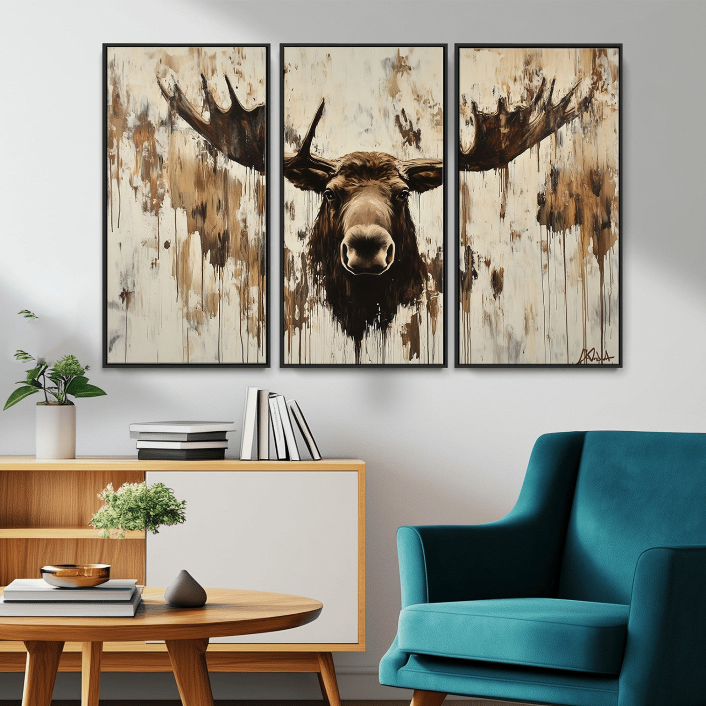 Expressive painting of a moose head with wide antlers in dark brown and beige tones, featuring paint drips and splatters on a light textured background, creating a striking rustic wall art canvas.