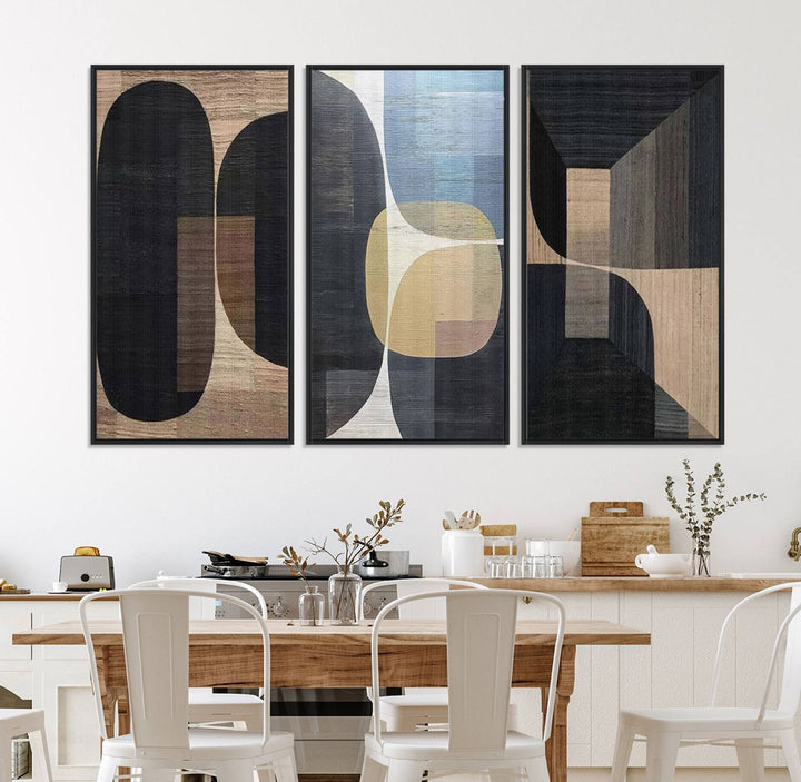 Abstract geometric wall art featuring black, gray, beige, and blue tones framed in a wooden border.