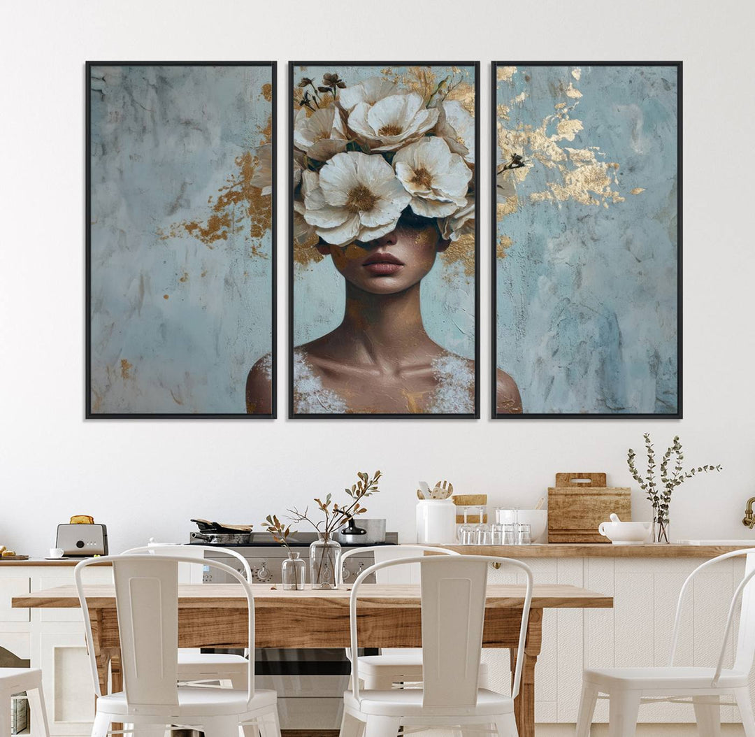 Golden Petal Wall Art: A womans face adorned with a gold floral design on a teal background, presented in a 3-panel modern glam canvas.