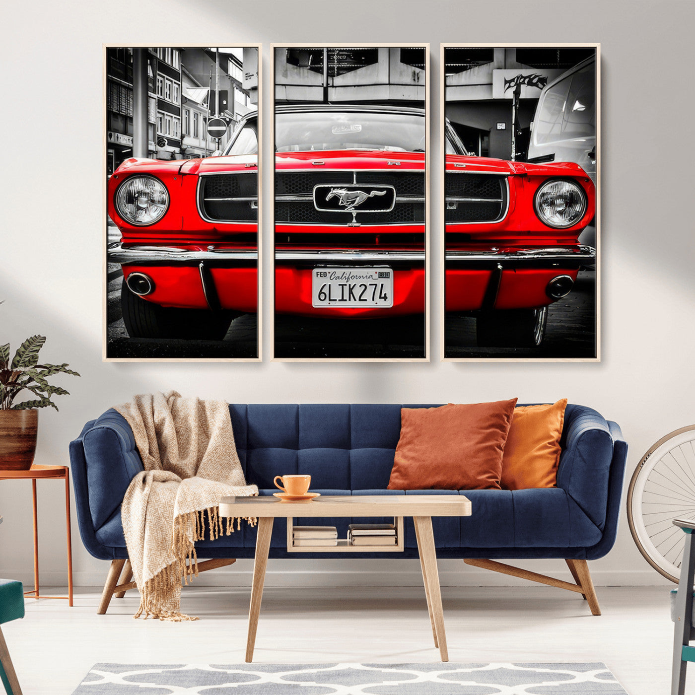 Front view of a bold red 1960s Ford Mustang parked in an urban environment, captured in dramatic contrast with a black-and-white city backdrop, emphasizing its timeless American muscle car identity.