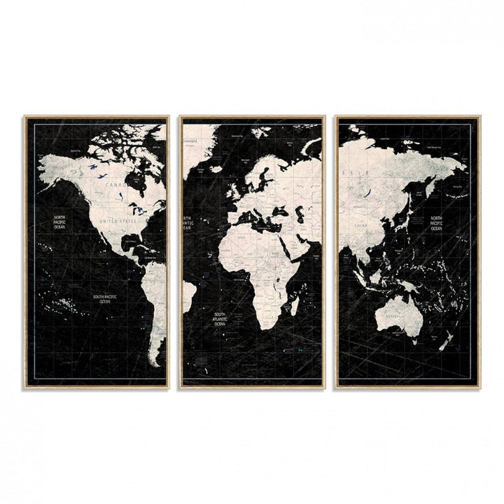 A bold global style framed black and white world map canvas print, presented in three panels, perfect for modern home or office decor.