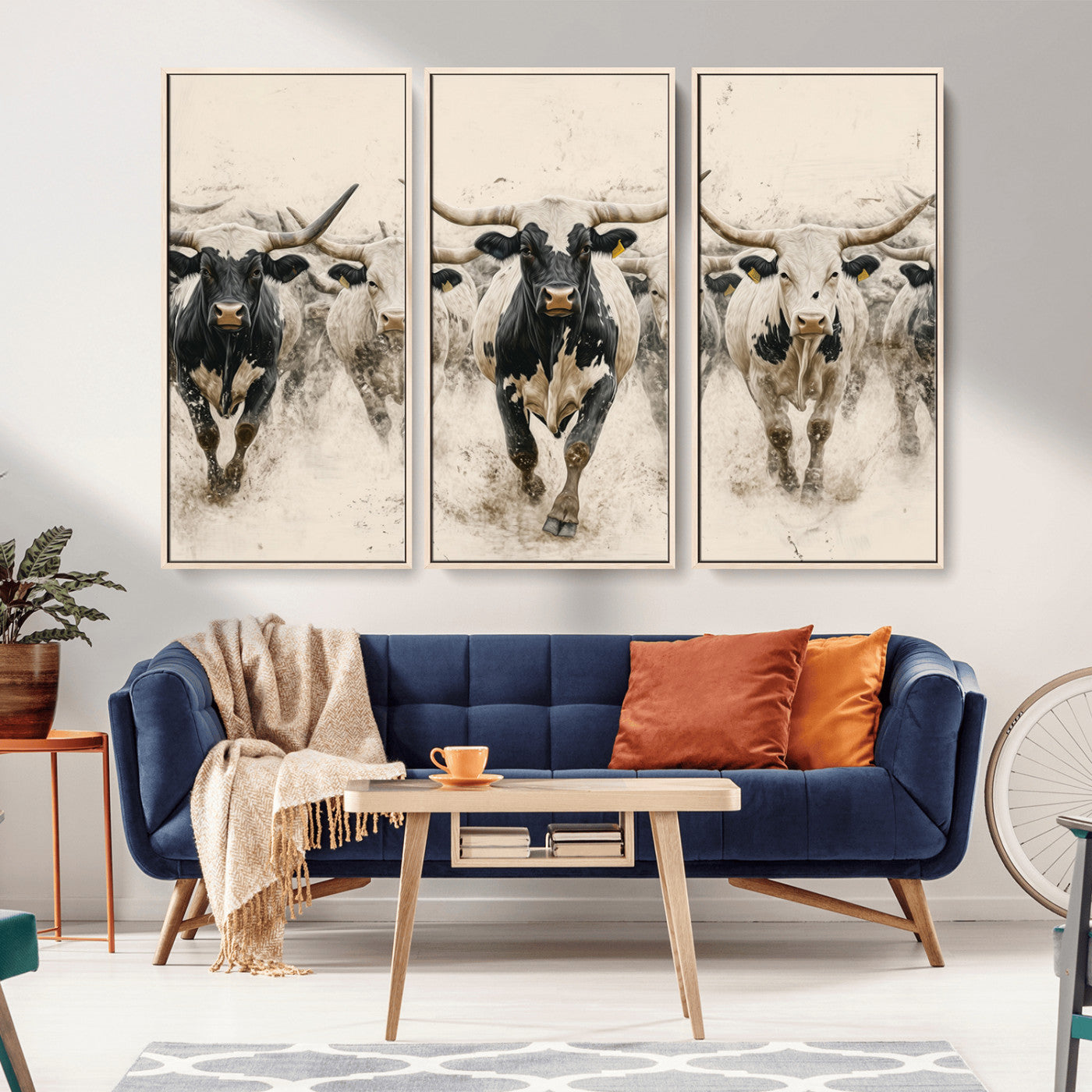 Canvas artwork of Texas Longhorn bulls walking in a dusty herd, ideal for rustic Western or country-style interior decor.