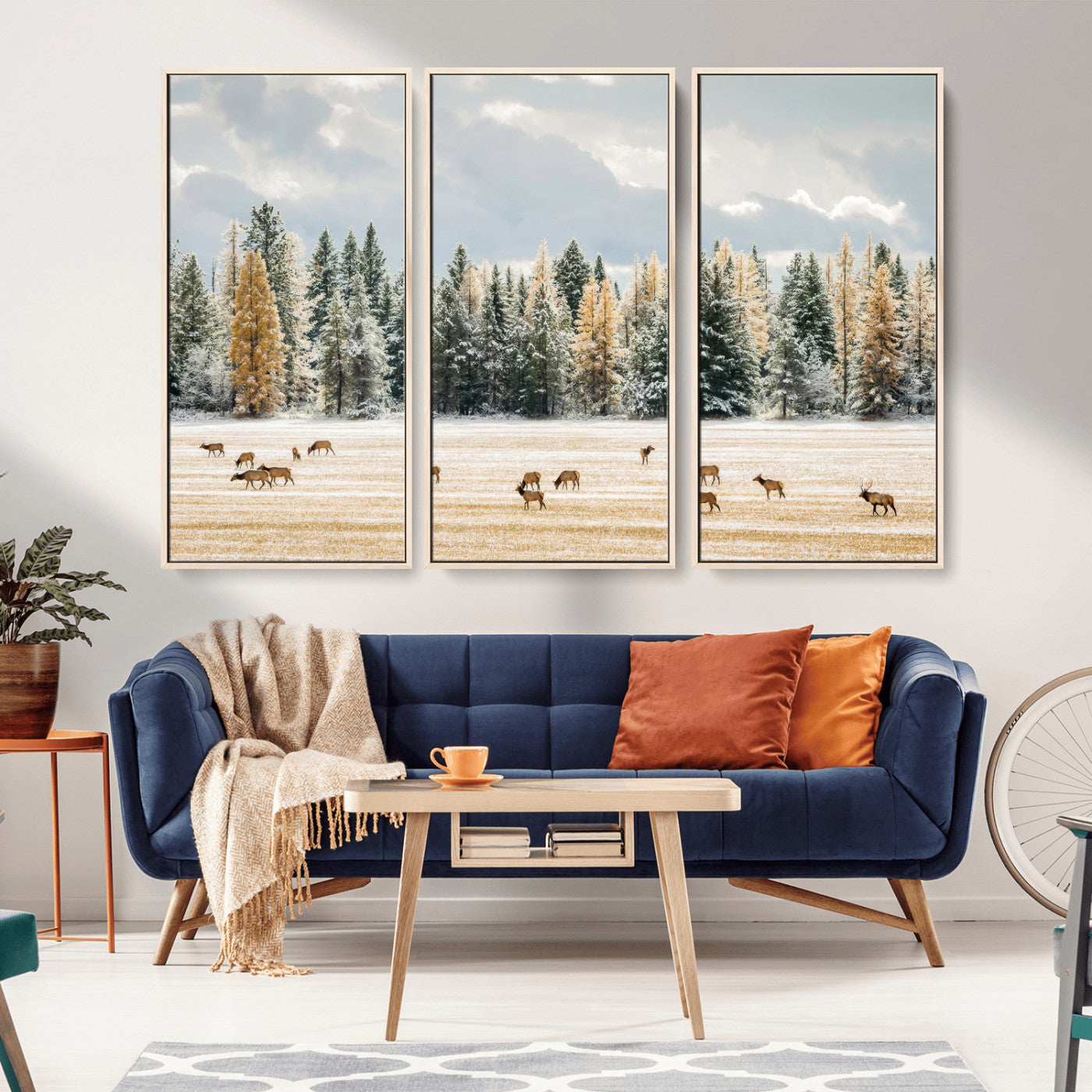 Elk herd in a snowy field with golden pine trees and frosted evergreens, ideal for neutral rustic or cabin-style home decor.