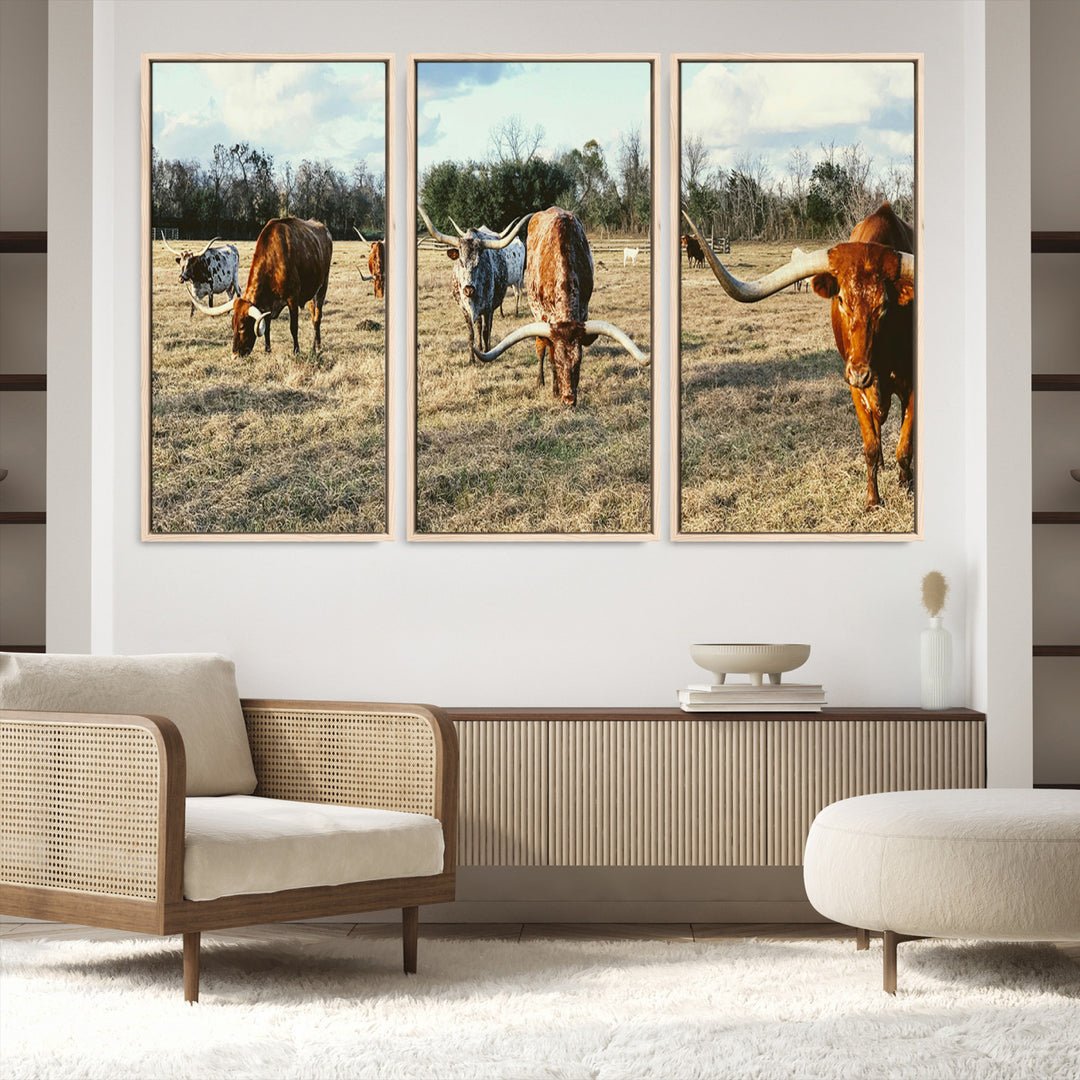 A herd of Texas Longhorn cattle grazing in an open field under a partly cloudy sky, capturing a rustic and Western ranch aesthetic.