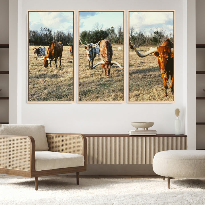 A herd of Texas Longhorn cattle grazing in an open field under a partly cloudy sky, capturing a rustic and Western ranch aesthetic.
