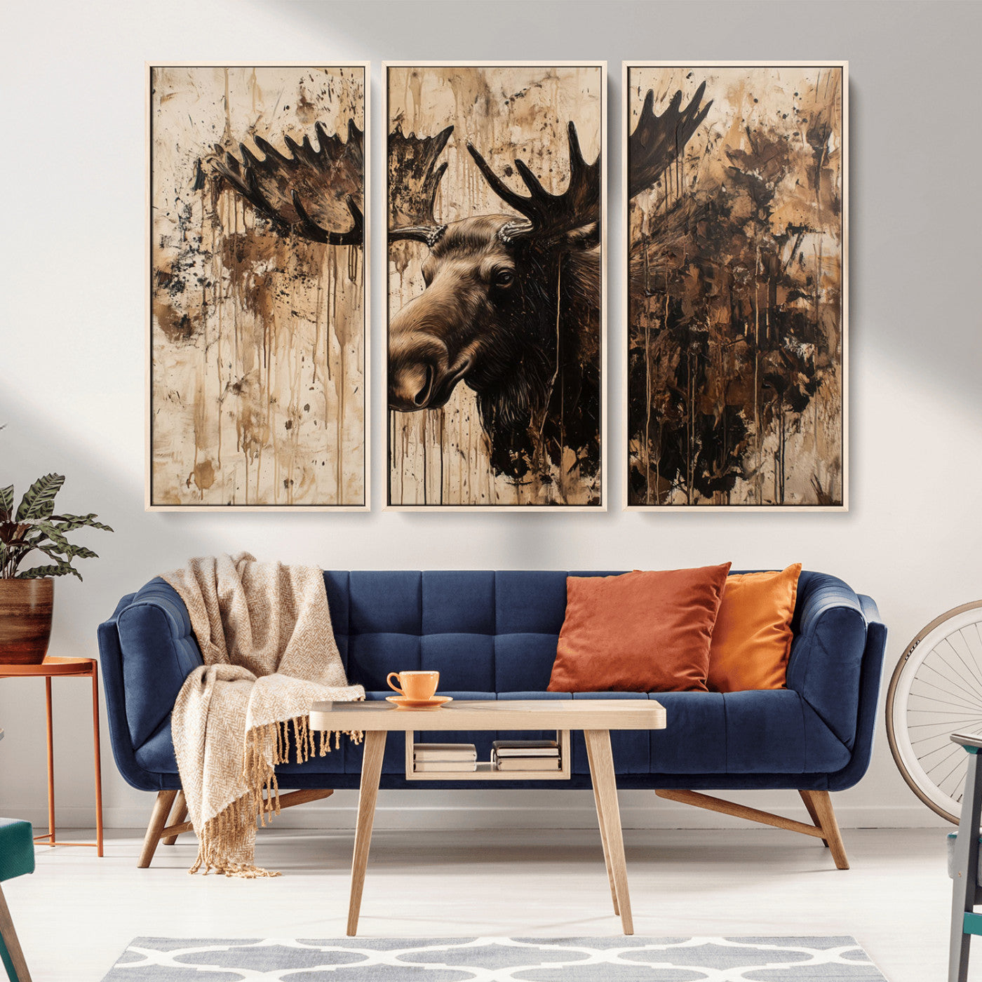 Artistic painting of a moose head with large antlers in shades of brown and black, with paint splatters and drips on a beige textured background, creating a rustic and expressive wall art canvas.