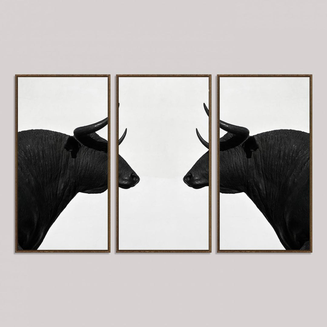 Spanish Bull Wall Art Canvas Print: Two black bull heads facing off on museum-quality canvas.