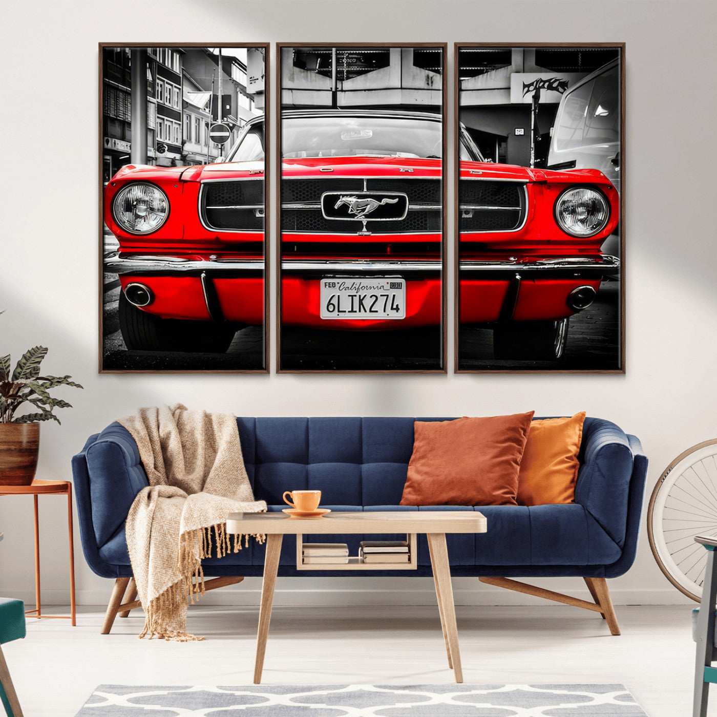 Front view of a bold red 1960s Ford Mustang parked in an urban environment, captured in dramatic contrast with a black-and-white city backdrop, emphasizing its timeless American muscle car identity.