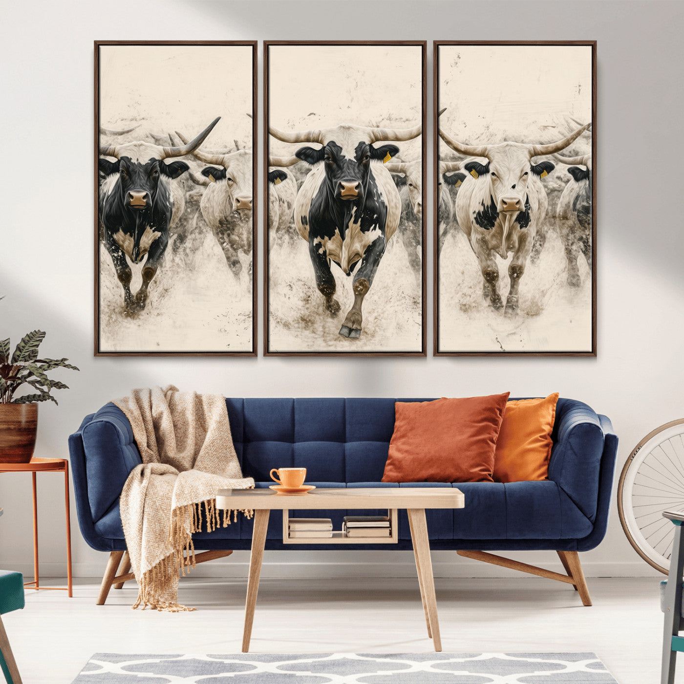 Canvas artwork of Texas Longhorn bulls walking in a dusty herd, ideal for rustic Western or country-style interior decor.
