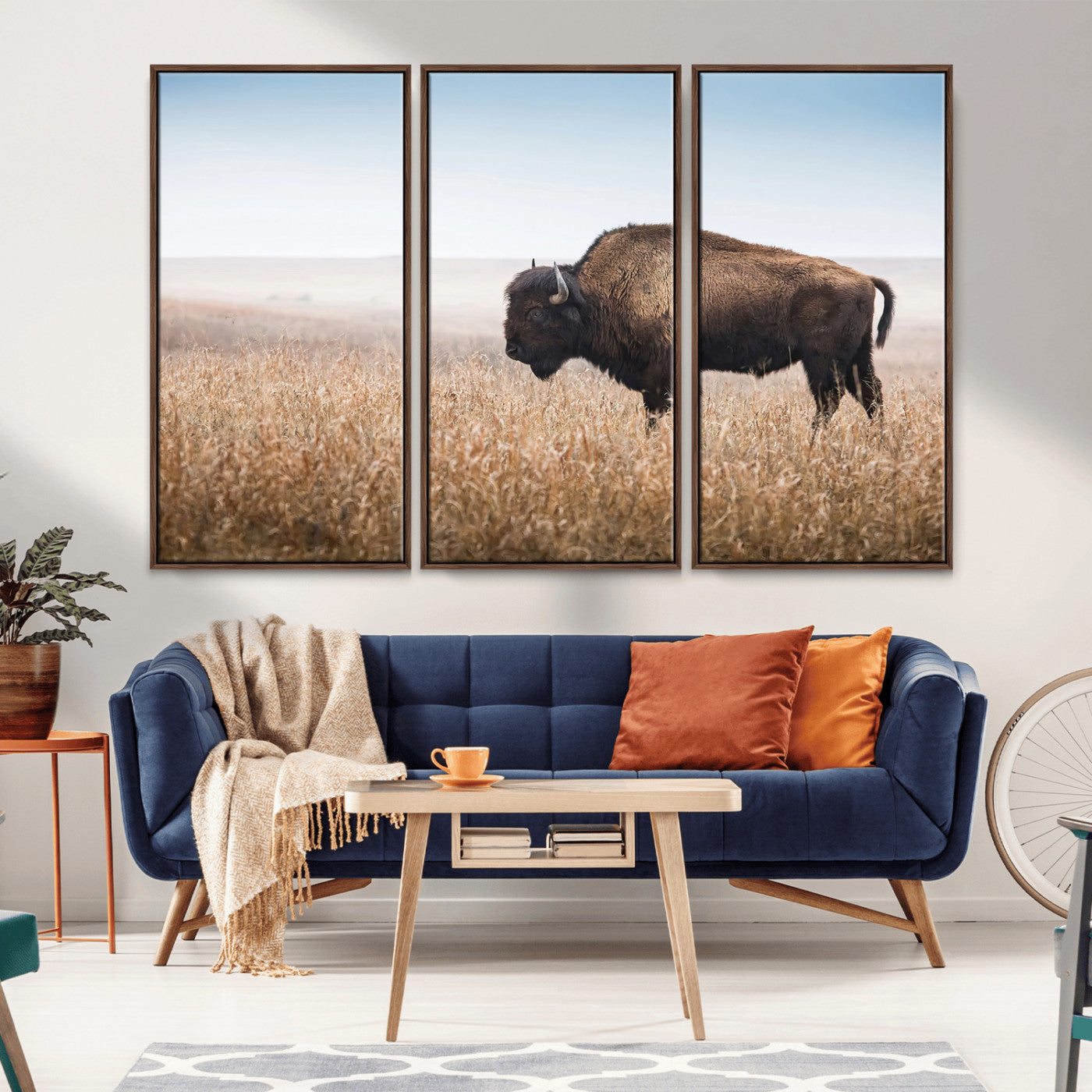 A solitary American bison stands in a dry grassland under soft skies, ideal for rustic or western-style home decor in warm neutral tones.