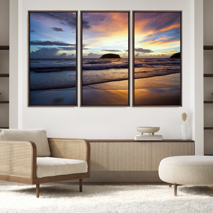 A tropical beach at sunset with waves gently washing ashore, reflecting golden and purple hues in the sky, creating a tranquil coastal scene.