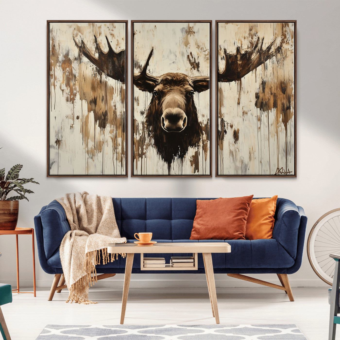 Expressive painting of a moose head with wide antlers in dark brown and beige tones, featuring paint drips and splatters on a light textured background, creating a striking rustic wall art canvas.