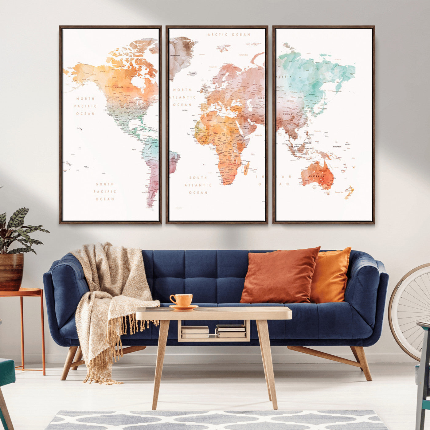 Watercolor world map featuring soft pastel hues in orange, green, blue, and purple on a light background, printed on canvas for vibrant and artistic wall decor.
