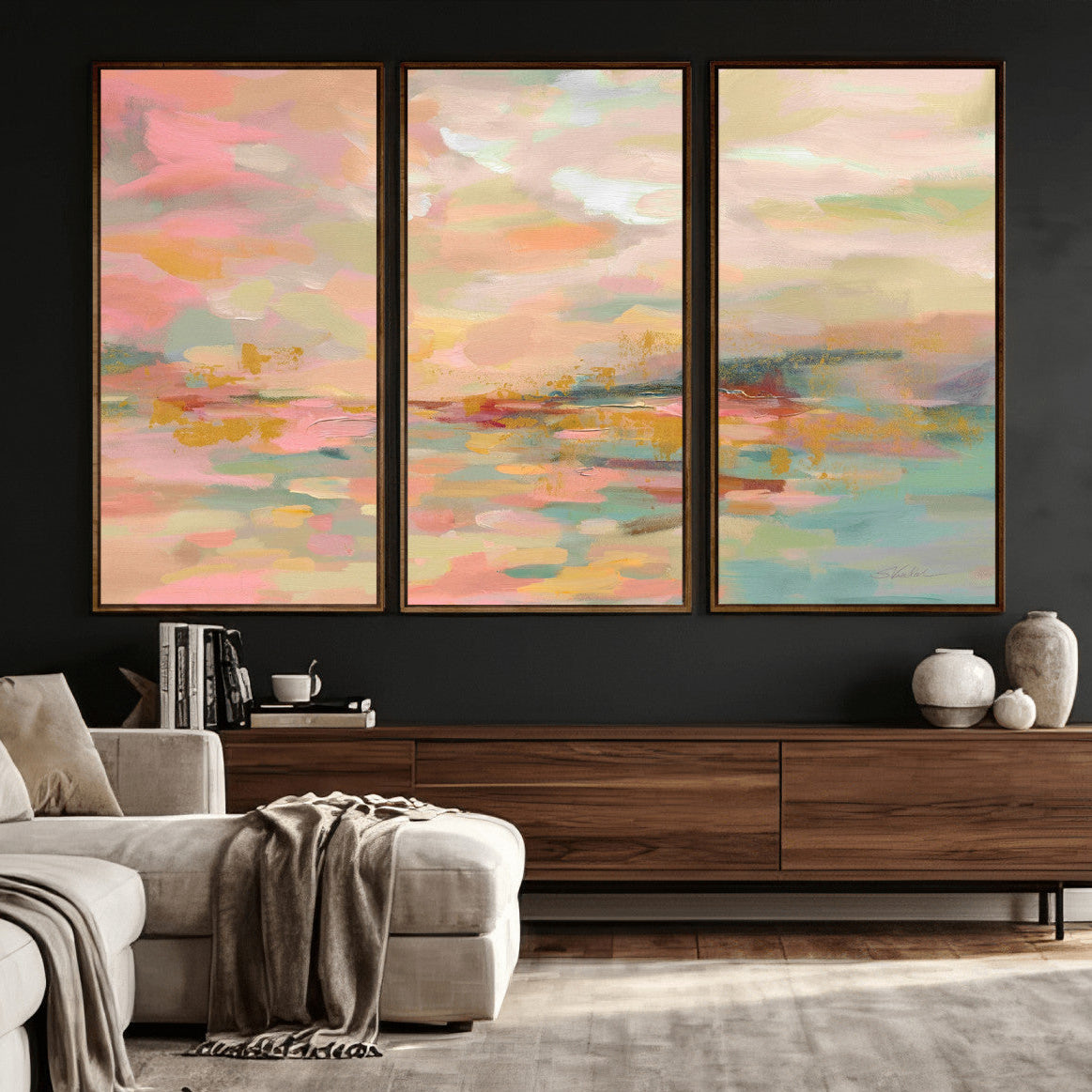 Living room with abstract art on the wall and a wooden console table.