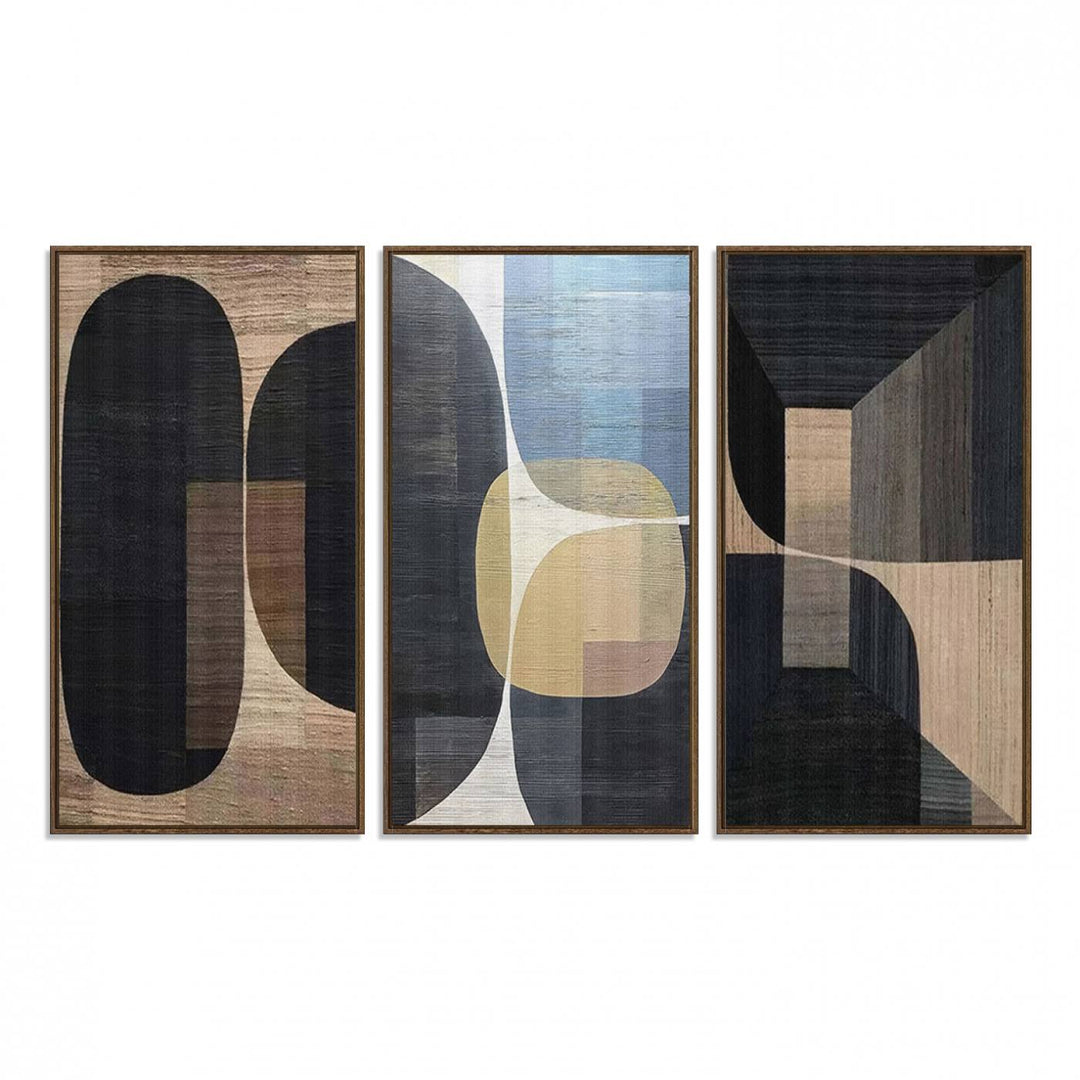 Abstract geometric wall art featuring black, gray, beige, and blue tones framed in a wooden border.