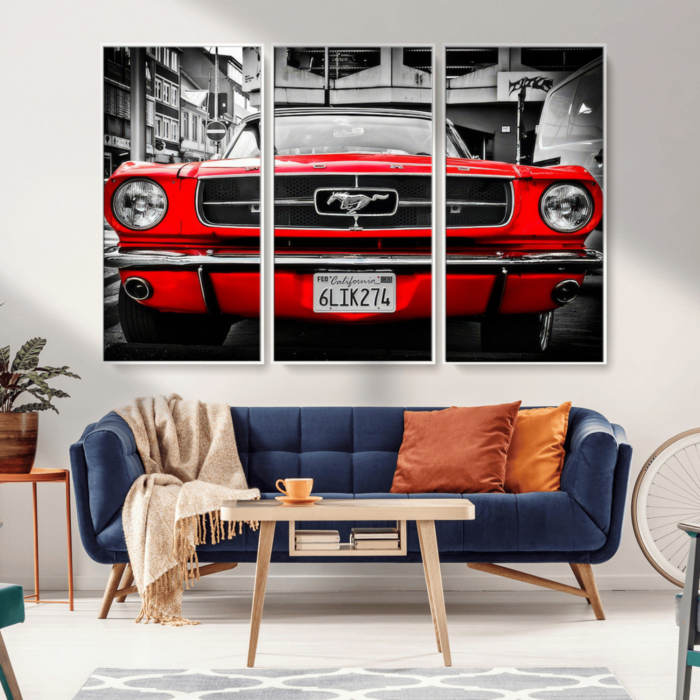 Front view of a bold red 1960s Ford Mustang parked in an urban environment, captured in dramatic contrast with a black-and-white city backdrop, emphasizing its timeless American muscle car identity.