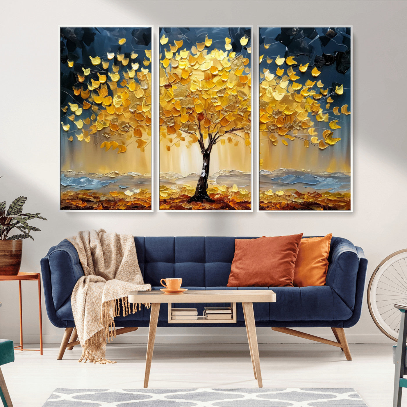 Canvas of a golden autumn tree with textured brushstrokes and moody blue skies, perfect for dramatic and vibrant home decor.