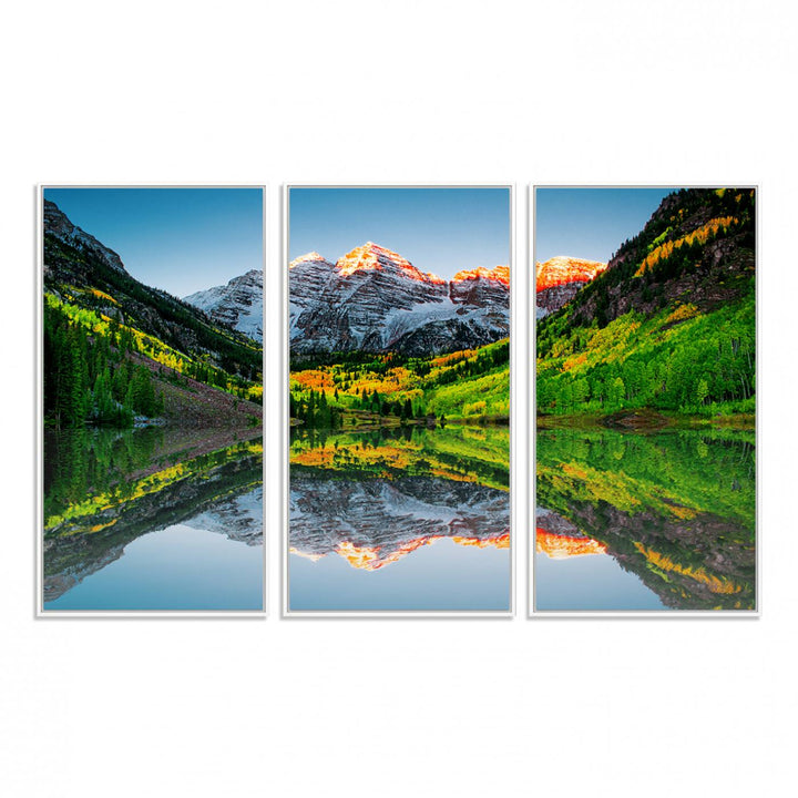 The Sunrise Maroon Bells Lake Wall Art Print beautifully captures North Maroon Peak mirrored in the tranquil lake, framed by lush greenery.