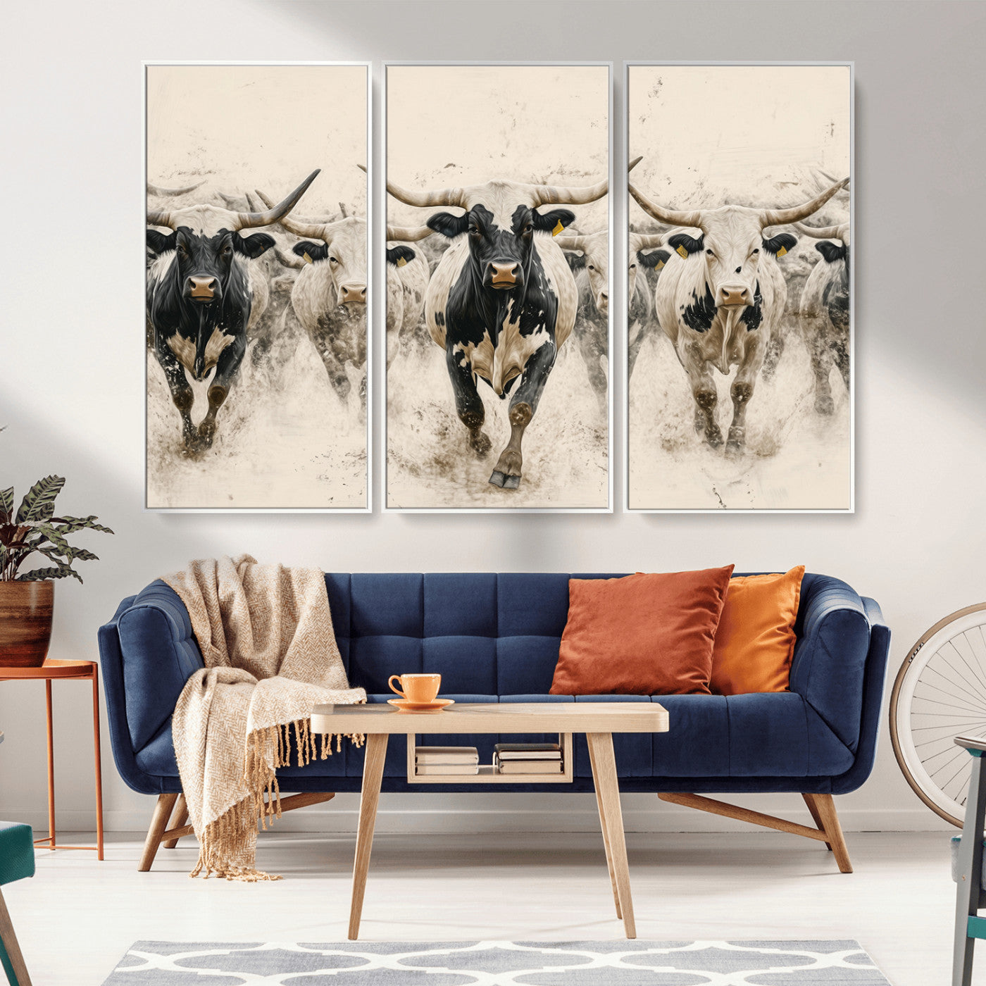 Canvas artwork of Texas Longhorn bulls walking in a dusty herd, ideal for rustic Western or country-style interior decor.