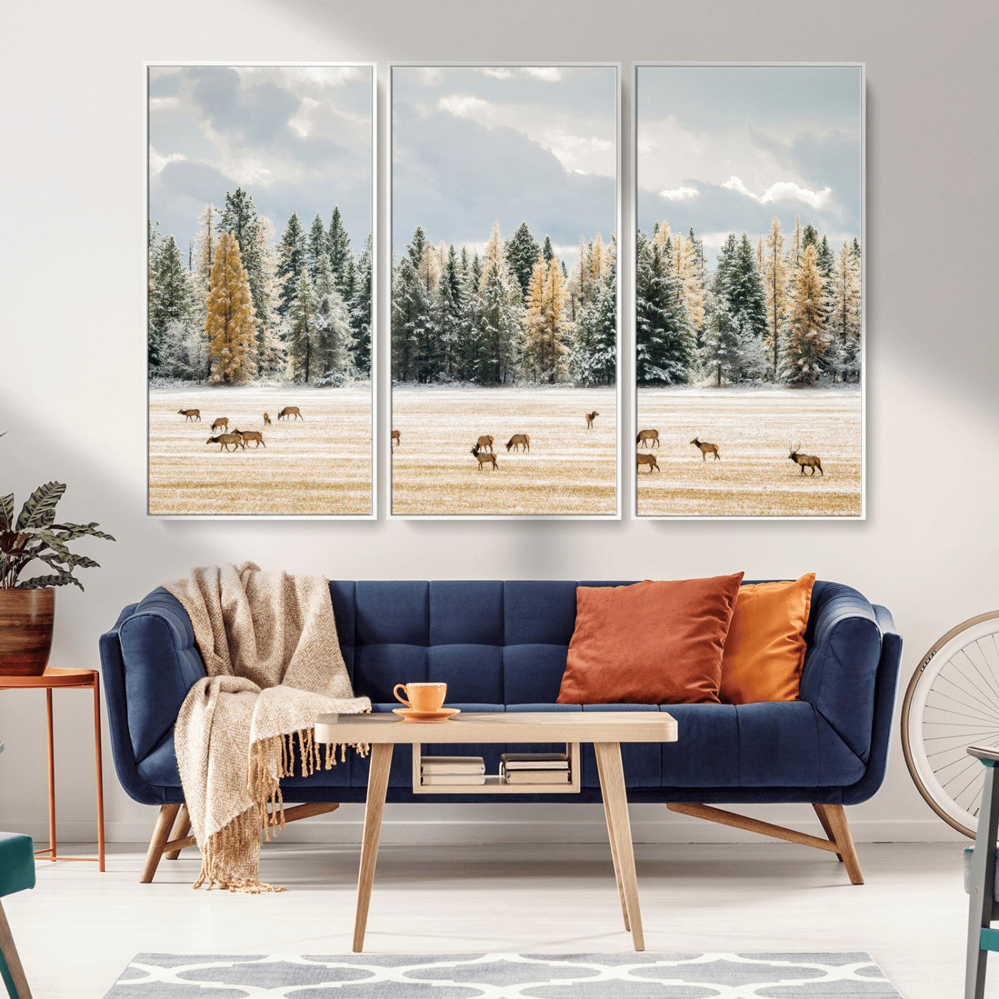 Elk herd in a snowy field with golden pine trees and frosted evergreens, ideal for neutral rustic or cabin-style home decor.