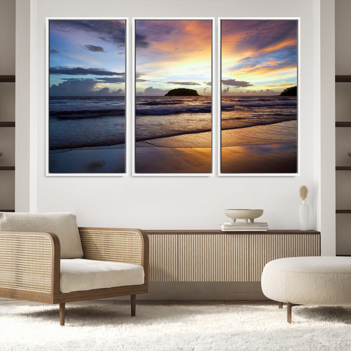 A tropical beach at sunset with waves gently washing ashore, reflecting golden and purple hues in the sky, creating a tranquil coastal scene.