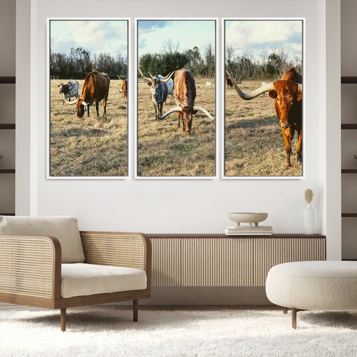 A herd of Texas Longhorn cattle grazing in an open field under a partly cloudy sky, capturing a rustic and Western ranch aesthetic.