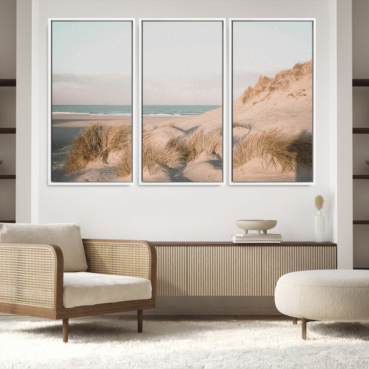 Soft pastel-toned beach scene with sand dunes, windswept grasses, and a calm ocean horizon, creating a serene coastal atmosphere.
